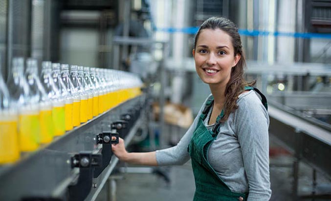 a beverage industry employee at a bottling line